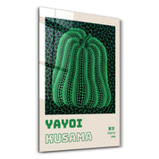 Glass wall art featuring Yayoi Kusama's green pumpkin design, showcasing vibrant Japanese pop art style by Artdesigna.