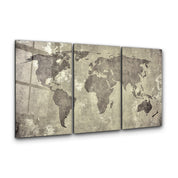 Vintage world map trio glass wall art by Artdesigna, featuring three framed map images with detailed antique-style designs.