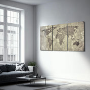 Vintage World Map Trio glass wall art by Artdesigna featuring three framed maps with intricate detailing on clear glass surfaces.