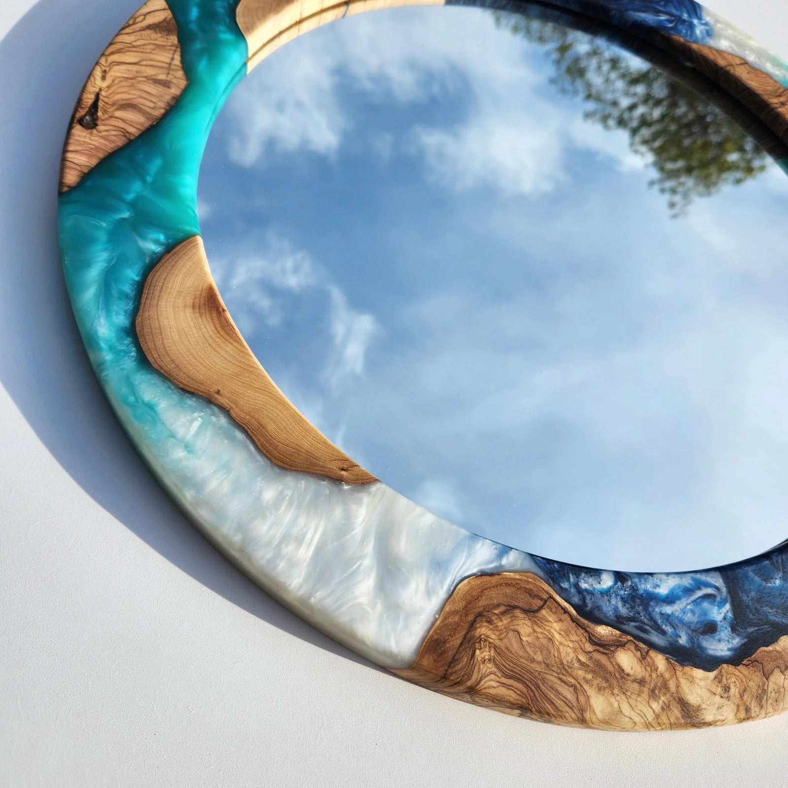 Ocean-inspired epoxy and olive wood wall art mirror by Artdesigna, featuring a unique wood frame with ocean-themed epoxy design.