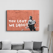 Banksy - You Loot We Shoot | Designer's Collection Glass Wall Art - Artdesigna