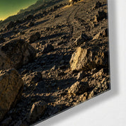 Greenish glass wall art by Artdesigna featuring abstract world loom design, mounted on a wall with corner view.