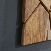 Handmade olive wood geometric wall sculpture by Artdesigna featuring intricate wooden patterns for modern wall decor.